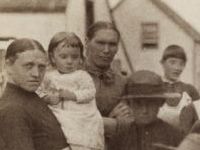 family standing by fence