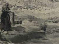 woman standing on rock