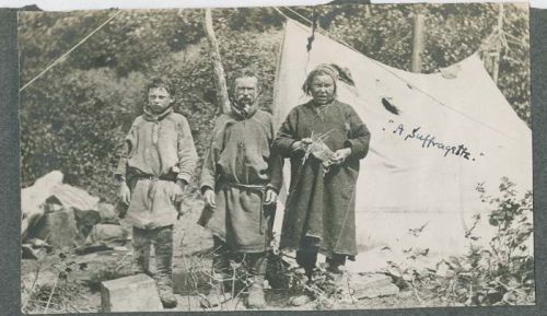 sami woman with family outside tent