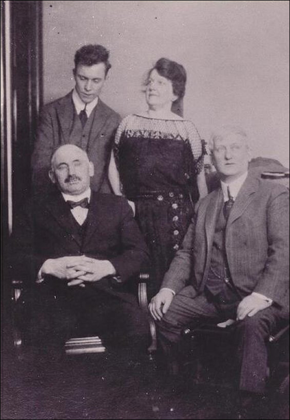 Sir William F. Coaker (bottom left) with three unidentified people.