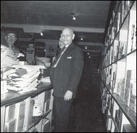 Zeb Russell, Joseph Parsons, and Alfred Hussey, in the dry goods department, Fishermen's Union Trading Company store.