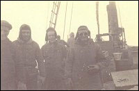 William Hynes, unidentified man, Steve Tulk and Captain Godfred Tulk, on board an unidentified vessel.