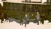 Group of men standing near a rescue boat