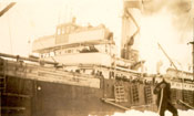 Man standing by the side of a ship