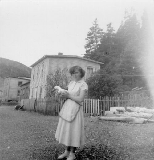 Rita Halfyard and duck 'Dilly', 1950