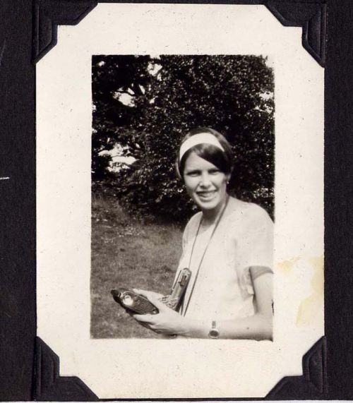 Isabel Warne holding camera, 1925