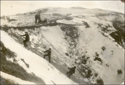 Men searching for bodies, February 1942