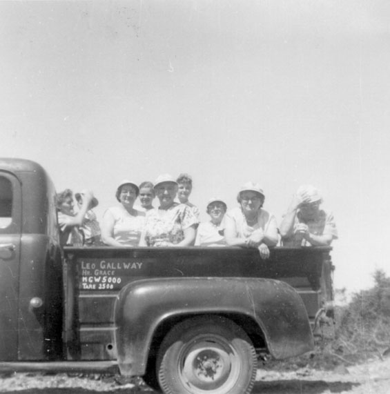 Group of women in a pickup truck during the construction of the Road from Harbour Buffett to Kingwell, Placentia Bay.
