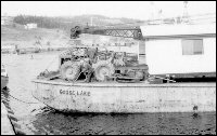 Moving a house on the barge "Goose Lake"