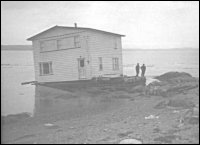 George and Alice Eastman house, North Harbour, Placentia Bay on the barge that brought it from Woody Island