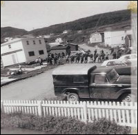 Pulling Mike and Hilda Symmonds house across the road in Conche