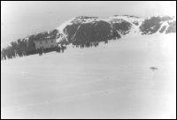 Elizah Soper house being pulled across the ice from House Cove to Little Heart's Ease, Trinity Bay