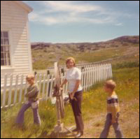 Rowena Caines with two children and a spinning wheel at Point Rosie